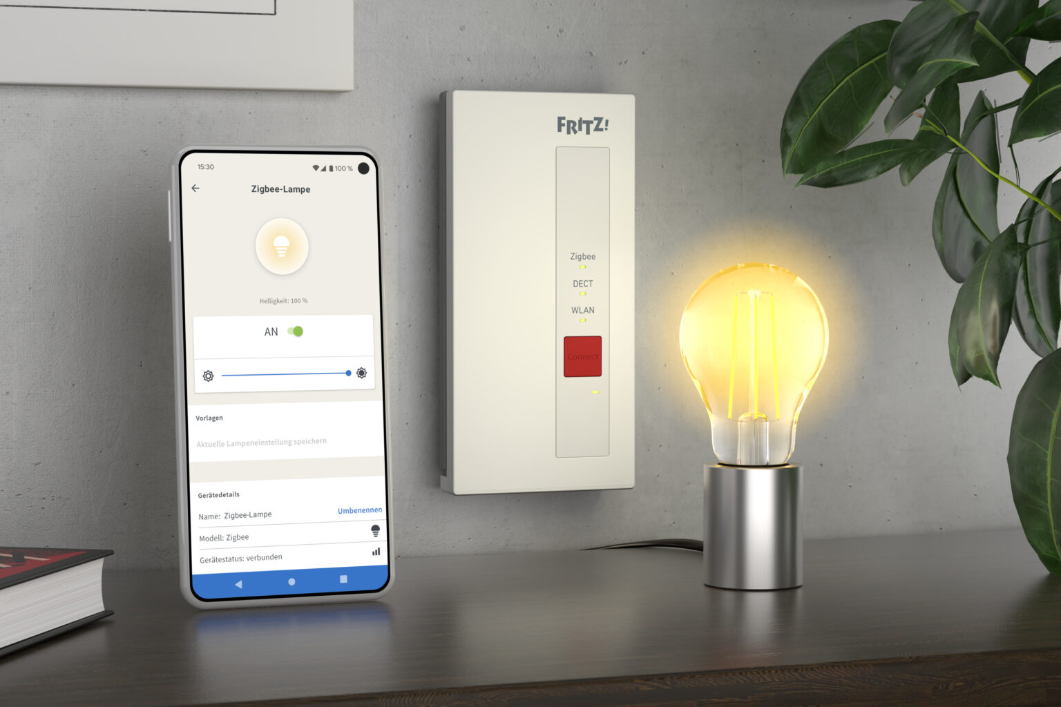 Fritz!Smart Gateway mit Handy und ZigBee-Leuchte daneben