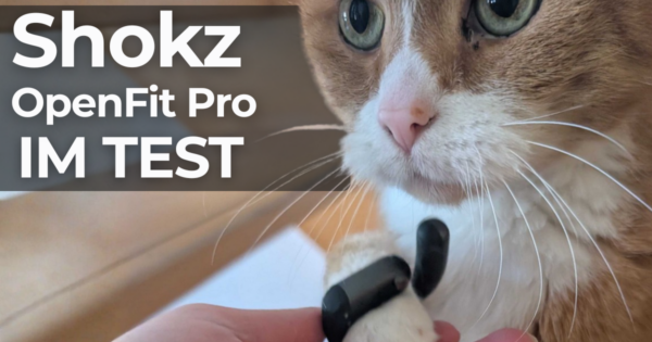Open Ear am Pfötchen eines orange-getigerten Katers mit Schrift "Shokz OpenFit Pro im Test"